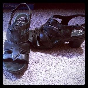 Black Dansko sandals with flower detail